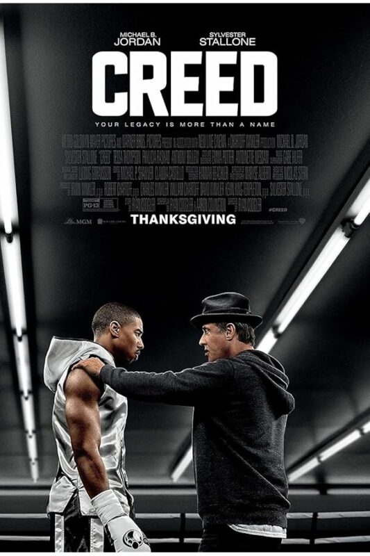 Young boxer receiving advice from coach.