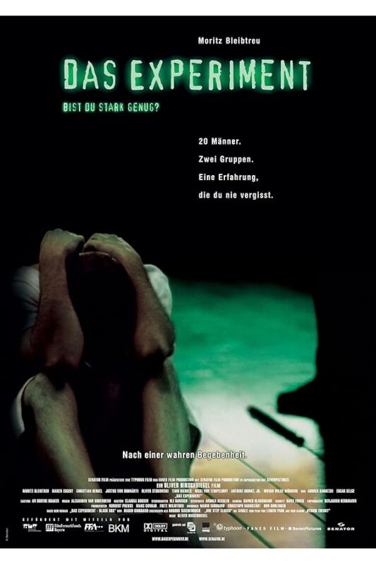 Hunched man covering face beneath green title