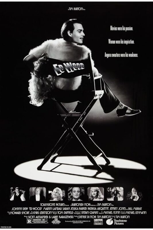 Man in angora sweater on director's chair