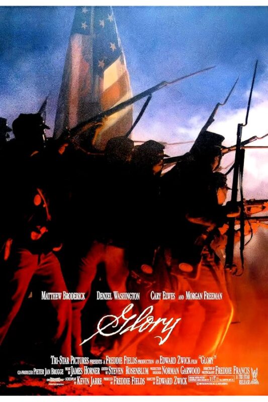 Silhouetted Civil War soldiers advancing beneath flag