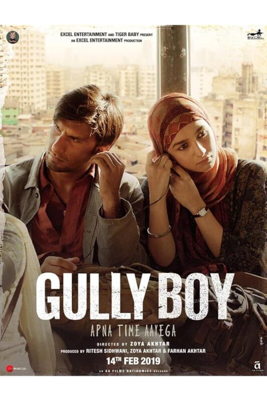 Young man and headscarfed woman sharing earphones