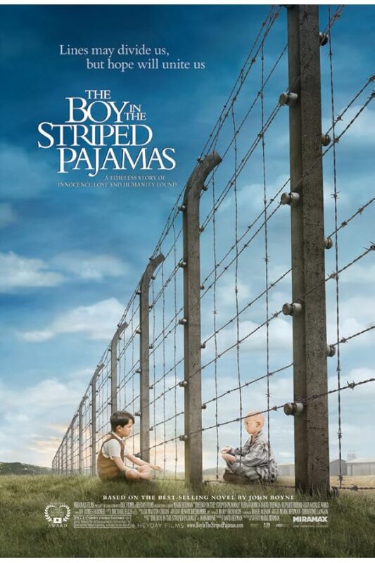 Two boys separated by a barbed-wire fence