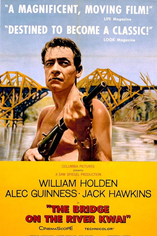Shirtless man holding rifle before bridge