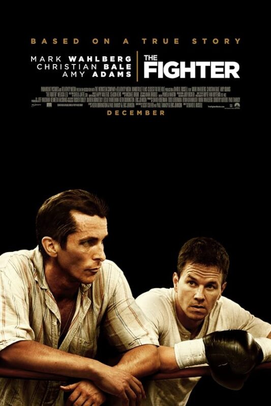 Two men leaning on boxing ring ropes