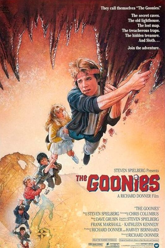 Kids dangling from cave stalactite chain