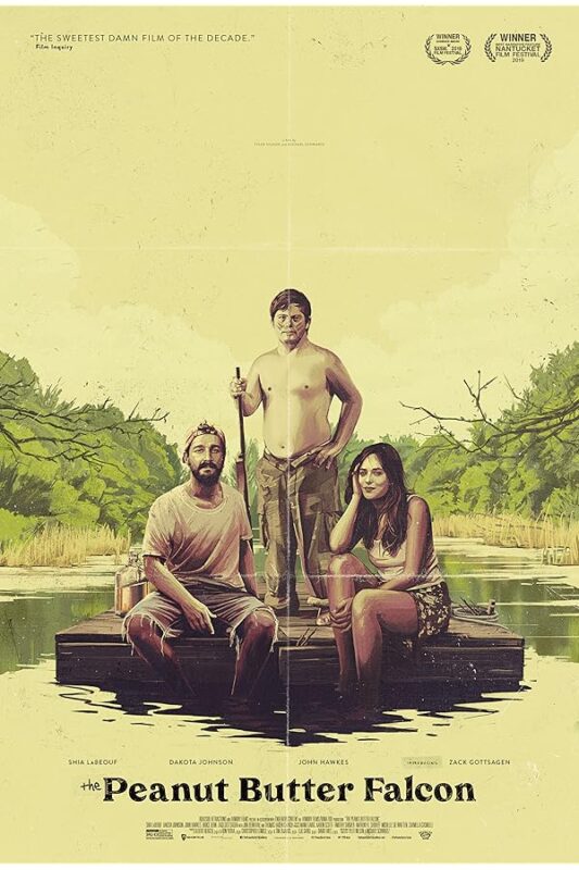 Three people on a raft in marsh